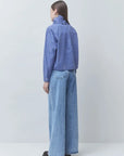 Checked Victorian-style shirt and wide-leg jeans by SUNCOO Lyes, back view against light background.