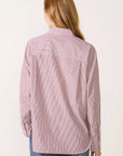 Rag & Bone Connie pinstriped shirt in red and white tucked into blue jeans, seen from the back.