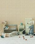 Maileg toy mice with vacuum cleaner in a playful, patterned kitchen setting by Bungalow Furniture & Accessories.