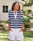 Frank & Eileen Patrick Henley Jersey in Nautical Stripe worn outdoors, styled with a green garden backdrop.