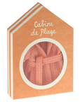 Folded coral Maileg bathrobe visible through window in the Peach Cabine de Plage house box by Maileg.