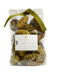 A clear bag of Potpourri Pine Cones by Faire, filled with pine cones scented with cedar and pine, and tied at the top with an olive green ribbon.