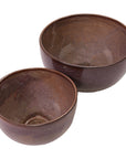 Two Linden Bowls by The Import Collection, featuring a brown glossy finish. The larger bowl is positioned behind the smaller, both set on a white background—ideal for adding style to your home decor.