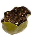 The Import Collection's Ava Bud Bowl features a sculptural, wavy design with a glossy olive green exterior and reflective gold interior—an elegant accent for modern interiors. Shown here against a white background.