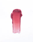 A vertical swatch of Faire 02-Tinted Lip Balm & Blush in mauve pink appears on a white background, displaying its smooth, hydrating formula with a dark-to-light gradient.
