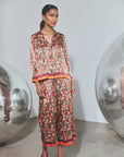Floral silk long-sleeved button-down shirt and matching Whisper Pant on model.