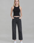 Denimist LUCY BF cropped jeans in light wash, styled with a black sleeveless top and white sneakers, gray background.