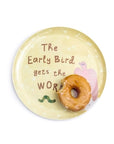 The Breakfast Club Plate Set by Sugarboo Designs features a yellow plate with "The Early Bird gets the Worm," a bird and worm illustration, and a glazed donut with a bite missing—a true Breakfast Of Champions.