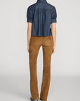 Lightweight denim Poise Top by FRAME with pointed collar, shown from the back.