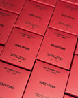 Several HONEYPUNK 12 oz candles by Faire are arranged in a grid, each box labeled with "The Sensory Riot Est. 2017" and "Intentionally Unexpected Spiced Honey Scented Soy Wax Candle.