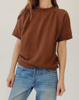 Cedar S/S Sweatshirt by Hey Gang in light color, paired with blue jeans, shown in a minimal studio setting.