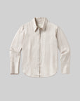 The camilia shirt S26 by Citizens Of Humanity/AGOLDE features long sleeves, a button-up front, a pointed collar, and subtle vertical stripes in light beige tones, all displayed on a plain gray background.