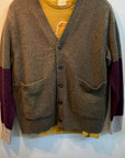 Olive Free City Cashmere Lux Cardigan with purple and grey sleeves worn over a yellow t-shirt.