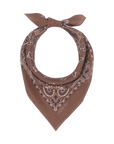 The Great Inc. presents The Silk Bandana, crafted from 100% silk and featuring white paisley patterns. It’s folded into a triangle and knotted at the top, showcased on a plain white background.