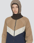Tan and navy zip-up jacket with white stitching, styled with a DECLAN BALACLAVA by Sea New York.