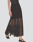 Black ribbed knit Sea New York Vali maxi skirt featuring a sheer tulle hem with intricate lace embroidery.