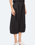 A person wearing the Sea New York Angelina Suiting Culotte paired with white oxford shoes and a black sleeveless top. The outfit fits true to size. Image is cropped at the chest, showing only the lower half of the body.