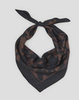 Black silk square scarf with brown animal print, logo in corner, CLOSED accessory on white background.
