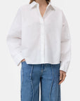 CLOSED embroidered shirt with high-waisted jeans, neutral background, modern style for Bungalow Furniture & Accessories.