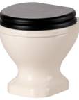 Small off-white ceramic mouse toilet with black lid by Maileg, perfect for a dollhouse bathroom or miniatures display.