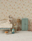 Maileg mouse snuggled in a floral bedroom with cozy decor, vintage toys, and Bungalow Furniture accents.