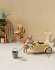 Maileg metal car, Mouse - Wheat, being washed by two toy mice with sponges in a playful setting.