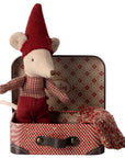Maileg Christmas baby mouse in red outfit and hat, nestled in a patterned suitcase with a small blanket.