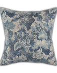 The Daphne Pillow by Moss Studio features painterly blue and gray vintage-inspired florals and leaves on a textured, linen-look white background.