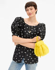 Bright yellow fuzzy shearling Emma drawstring handbag with double top handles by Bungalow Furniture & Accessories.