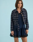 Hunter Bell NYC Dorrington Jacket in blue styled over a dress, modeled against a light blue background.