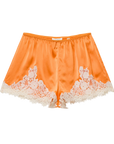 The DOEN Iona Short is a high-waist orange satin pair, featuring white floral lace trim along the hem and sides, shown on a white background.