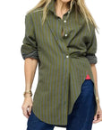 Kerri Rosenthal Jack Flannel Shirt in plaid with rolled sleeves, styled with blue jeans against a white backdrop.