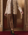Western Fringe Sweater Jacket by The Great Inc. in a cozy indoor setting, styled with mixed patterns for a modern look.