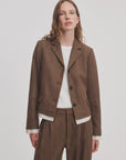 Brown herringbone pinstripe Rag & Bone Lawrence crop blazer with notched lapels and three buttons worn over a white shirt.