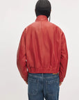 Red Rag & Bone Marissa leather scarf bomber jacket with stand collar and ribbed hem, back view styled with jeans.
