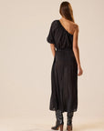 Black one-shoulder polka dot Erin Top by Natalie Martin, 70s-inspired style, shown on model against neutral backdrop.