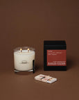 Oak Moss candle in a clear glass jar with a black box and matches by Bungalow Furniture & Accessories.