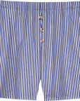 The Stripe Pop Boxer by Donni features blue and white vertical stripes, three brown front buttons, and is made from lightweight, breathable cotton poplin. These men's boxers offer a relaxed fit and are crafted in Los Angeles.