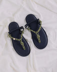 Flowze FLO military green sandals with rope straps on white fabric, available at Bungalow Furniture & Accessories.