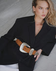 Tan Streets Ahead Inc Big Buckle Western belt with ornate antique silver hardware worn with a black blazer.