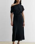 Rachel Comey Pout Dress in black crinkled crepe, styled with brown heels against a white backdrop.