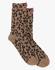 The Half Step by Mother: brown tube socks featuring a black leopard print and small red text at the top and toe, shown on a white background.