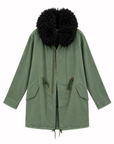 Olive green utility anorak by Le Superbe featuring an oversized black faux-fur collar and drawstring waist.