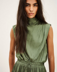 BA&SH Celea sleeveless olive green satin midi dress modeled with confidence, showcased for Bungalow Furniture & Accessories.