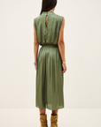 Sleeveless green BA&SH Celea midi dress with draped collar, styled with brown boots at Bungalow Furniture.