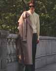 Cashmere Zip Polo by Sold Out NYC styled with dark pants and tan coat, relaxed outdoor setting.