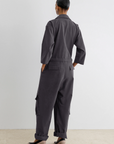 Charcoal gray gabardine Rachel Comey Meet Jumpsuit with cargo pockets and cuffed hems, styled with block-heel pumps.