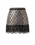 Le Superbe Pyramid mini skirt in metallic herringbone sequins with a black scalloped lace hem.