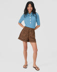 Clare Vivier St. Martin Shorts in blue styled with matching top, shown on model against a white background.