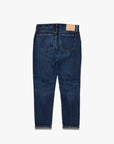 Carroll Tapered jeans in dark blue stretch denim, back view with tan leather patch.